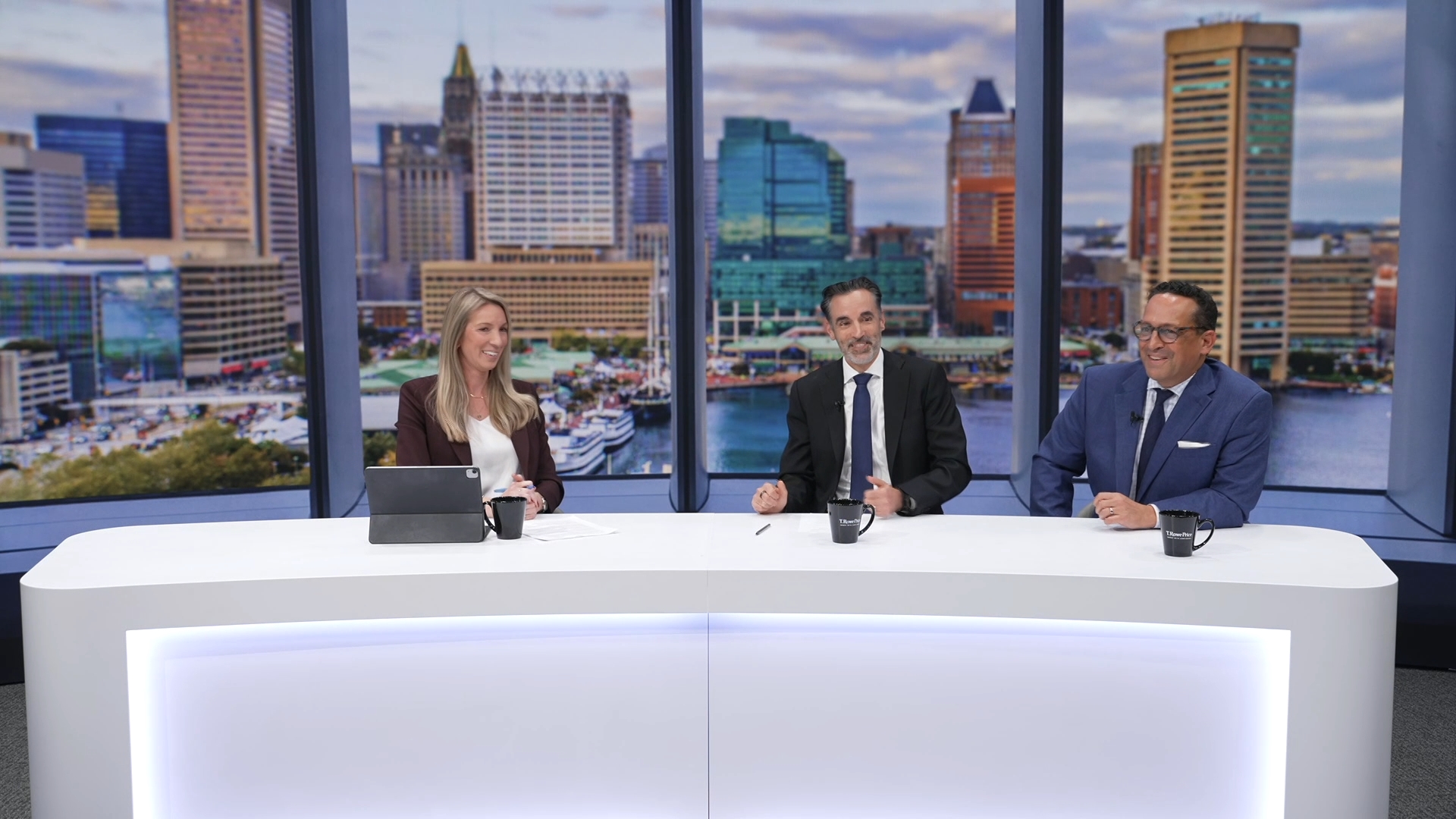 a panel of one women and two men speaking