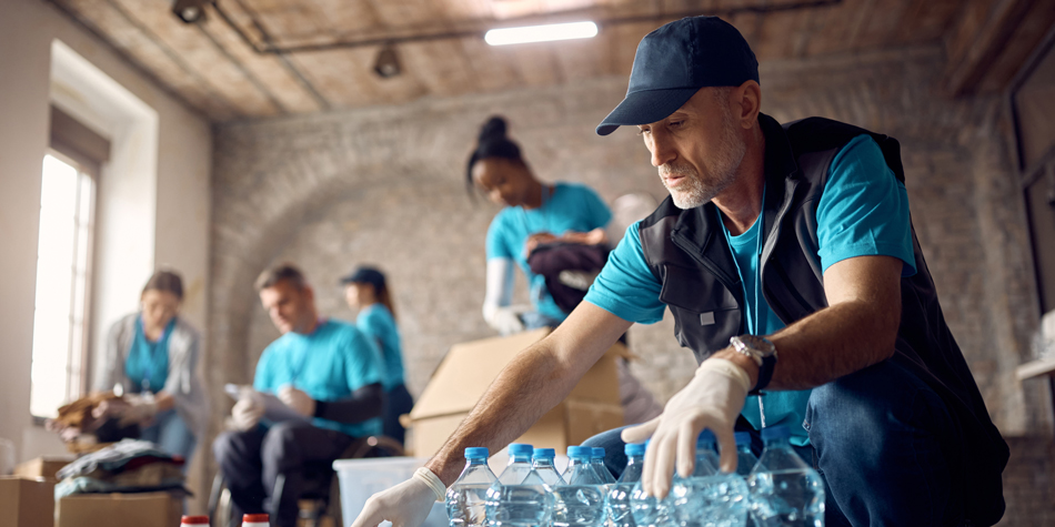 Man volunteering/doing charitable work.