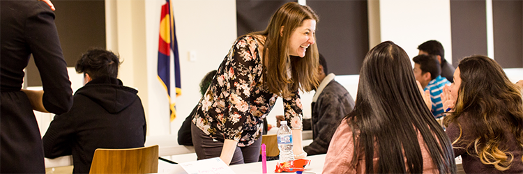 High school students network with an T. Rowe Price associate at a Career Day event.