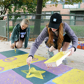 Women painting the ground