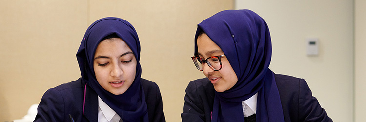 Two students work on a project during the Career Day event.