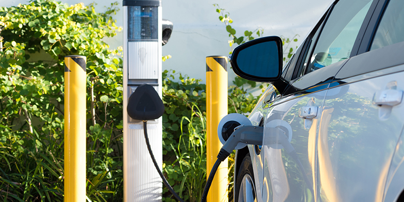 An electric car charging in California