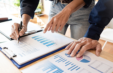 Business People Meeting to analyse and discuss and brainstorming the financial report chart data in office, Financial advisor teamwork and accounting concept