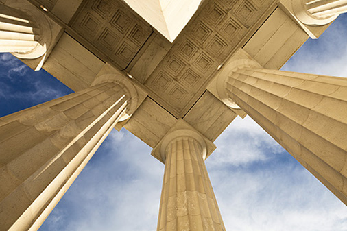 Ground level shot of columns supporting a building