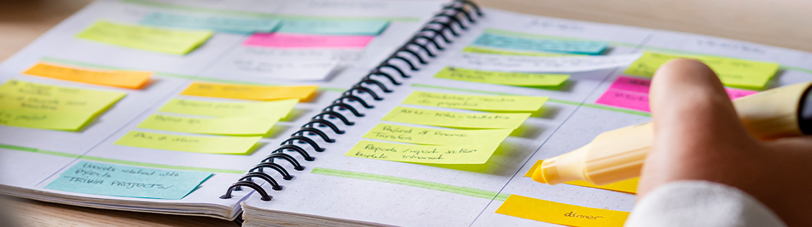 image in article of a notebook with colored sticky notes and marker