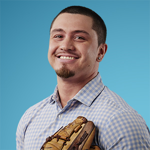 Danny Martinez holding a baseball mitt up against his chest