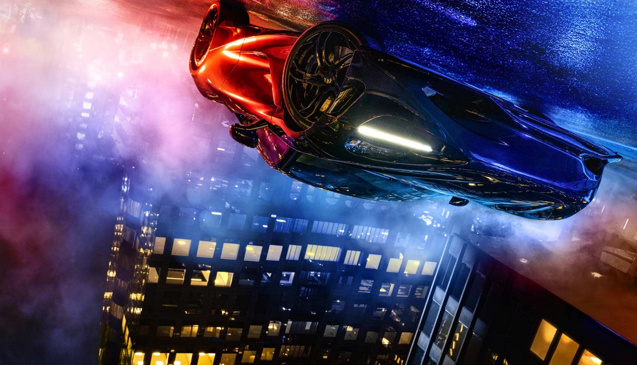 Man dressed in a suit dancing in a fountain.